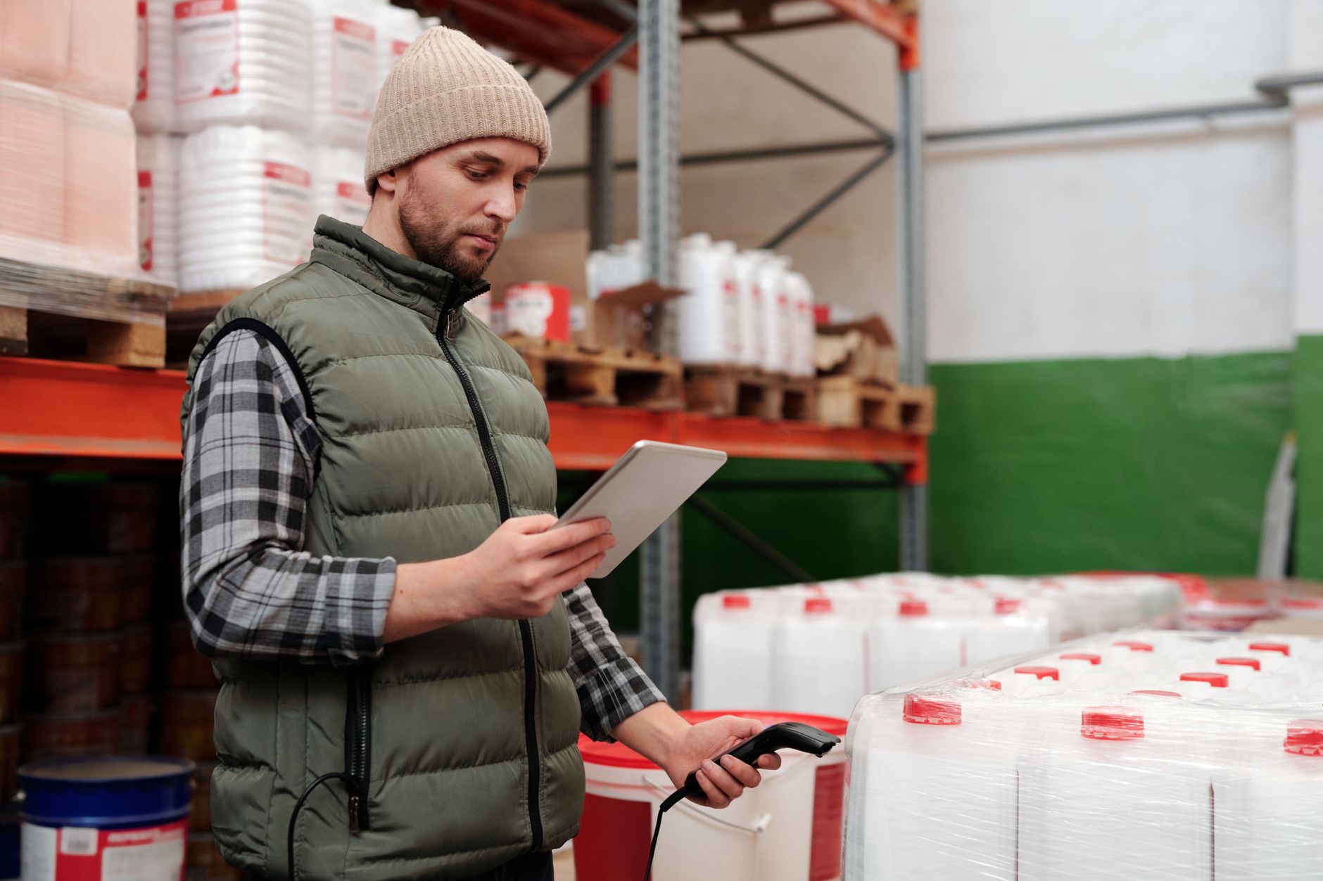 Worker scanning a barcode on a production line to record traceability data
