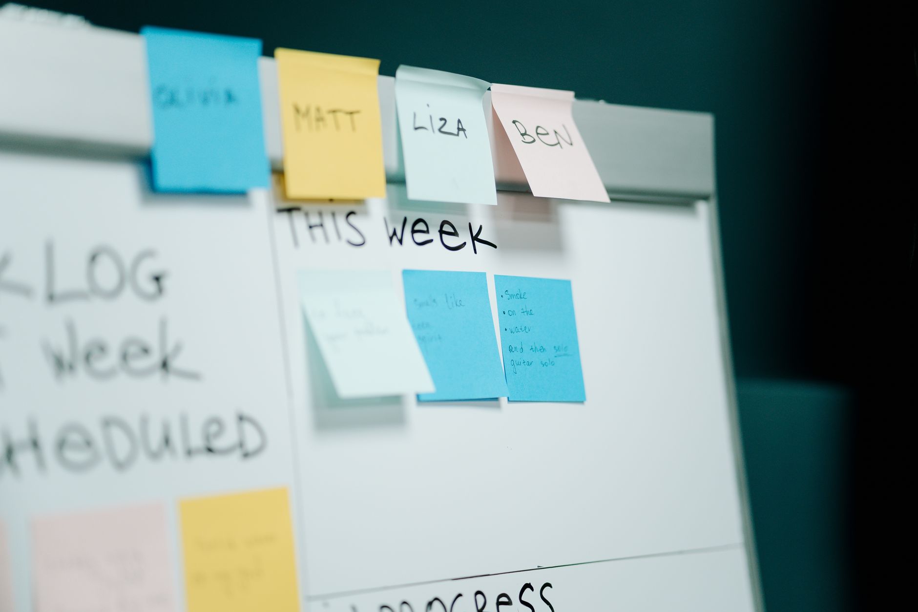Engineer reviewing a production routing and work order flow diagram on a whiteboard
