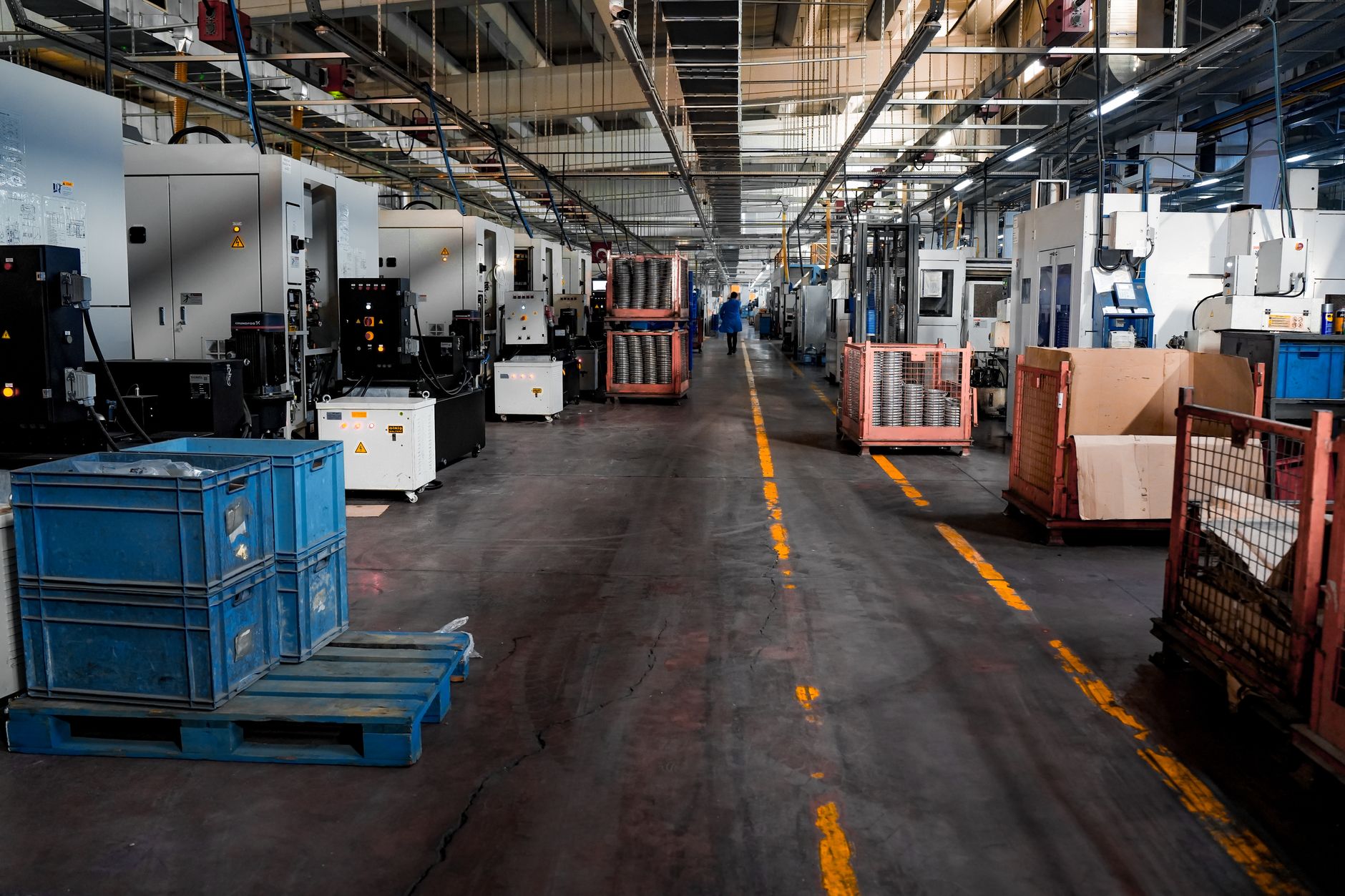 Manufacturing worker reviewing traceability data on a tablet on the plant floor