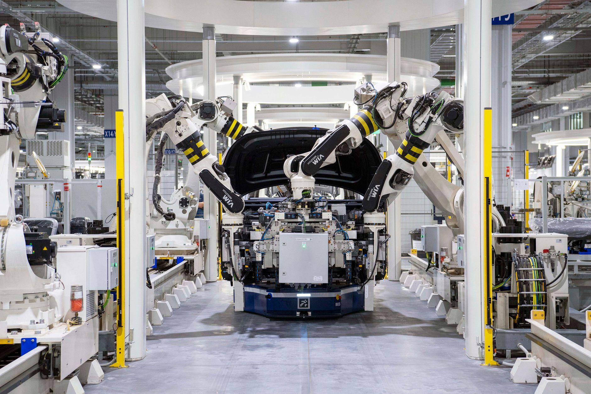 Autonomous mobile robots navigating a factory floor under industrial wireless network infrastructure