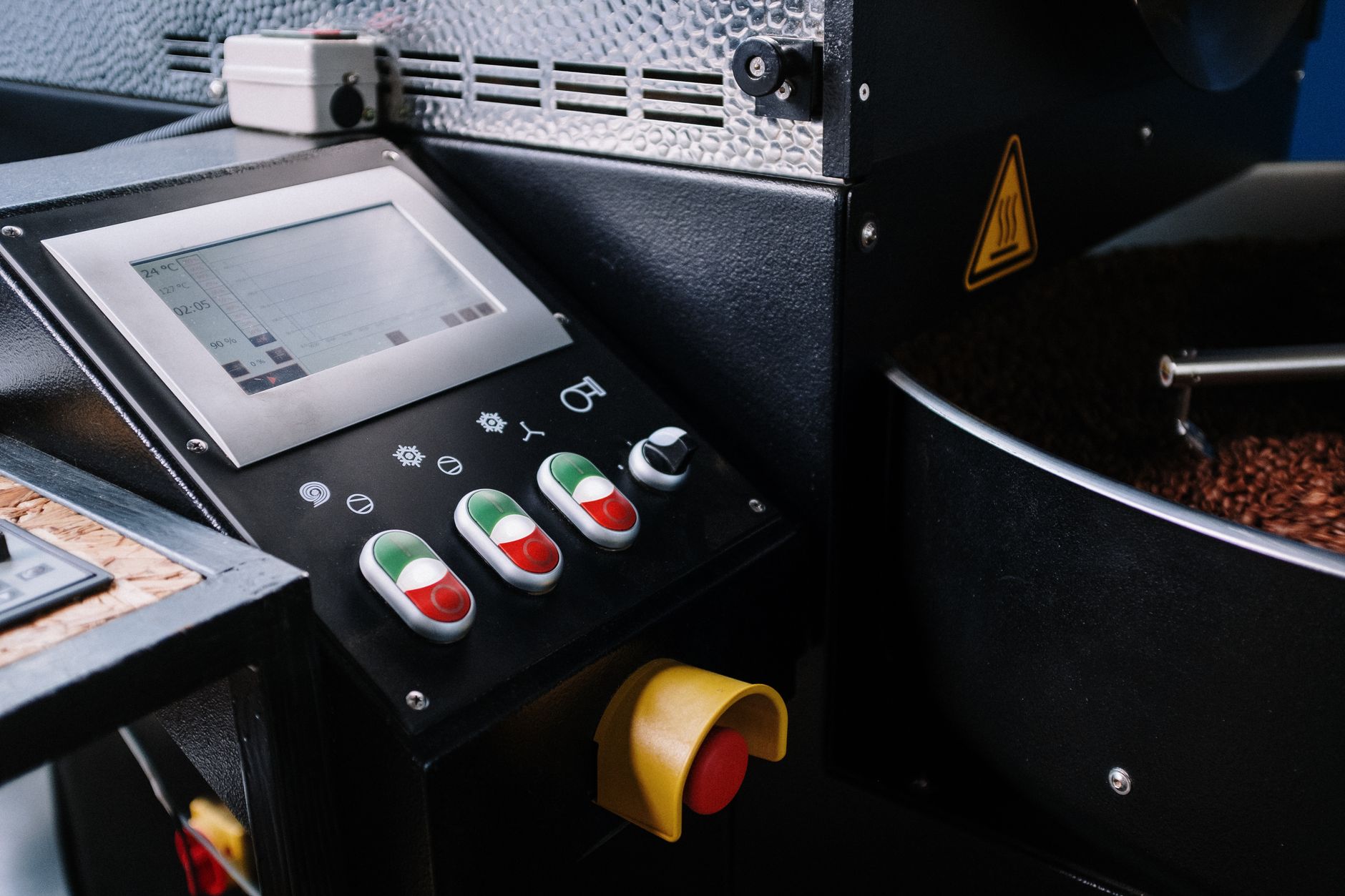 An HMI screen on a factory floor displaying machine state and mode information