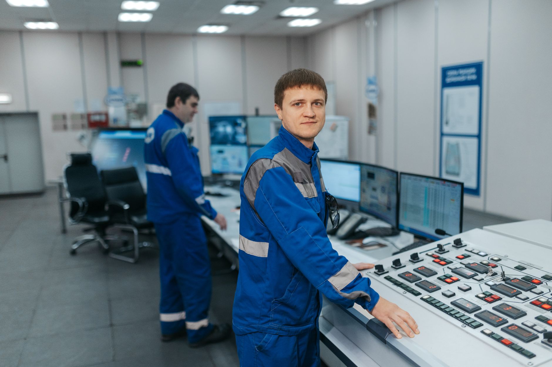 Plant engineer reviewing control system alerts on an industrial HMI screen