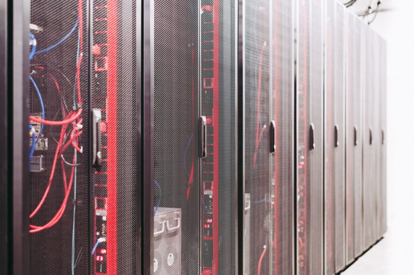 Server racks and control room displays representing an industrial data historian environment