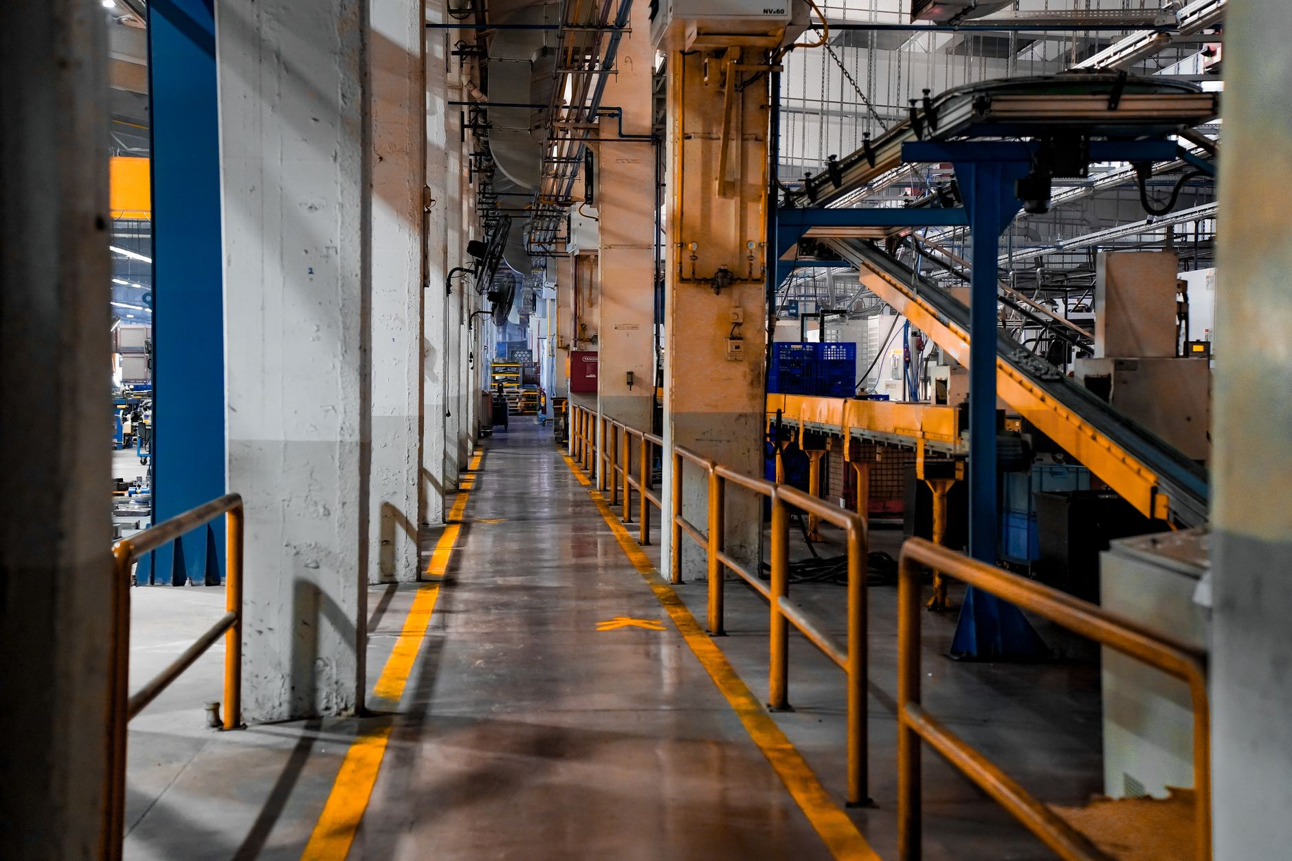 An industrial PC mounted near a production line, representing edge AI hardware on the shop floor