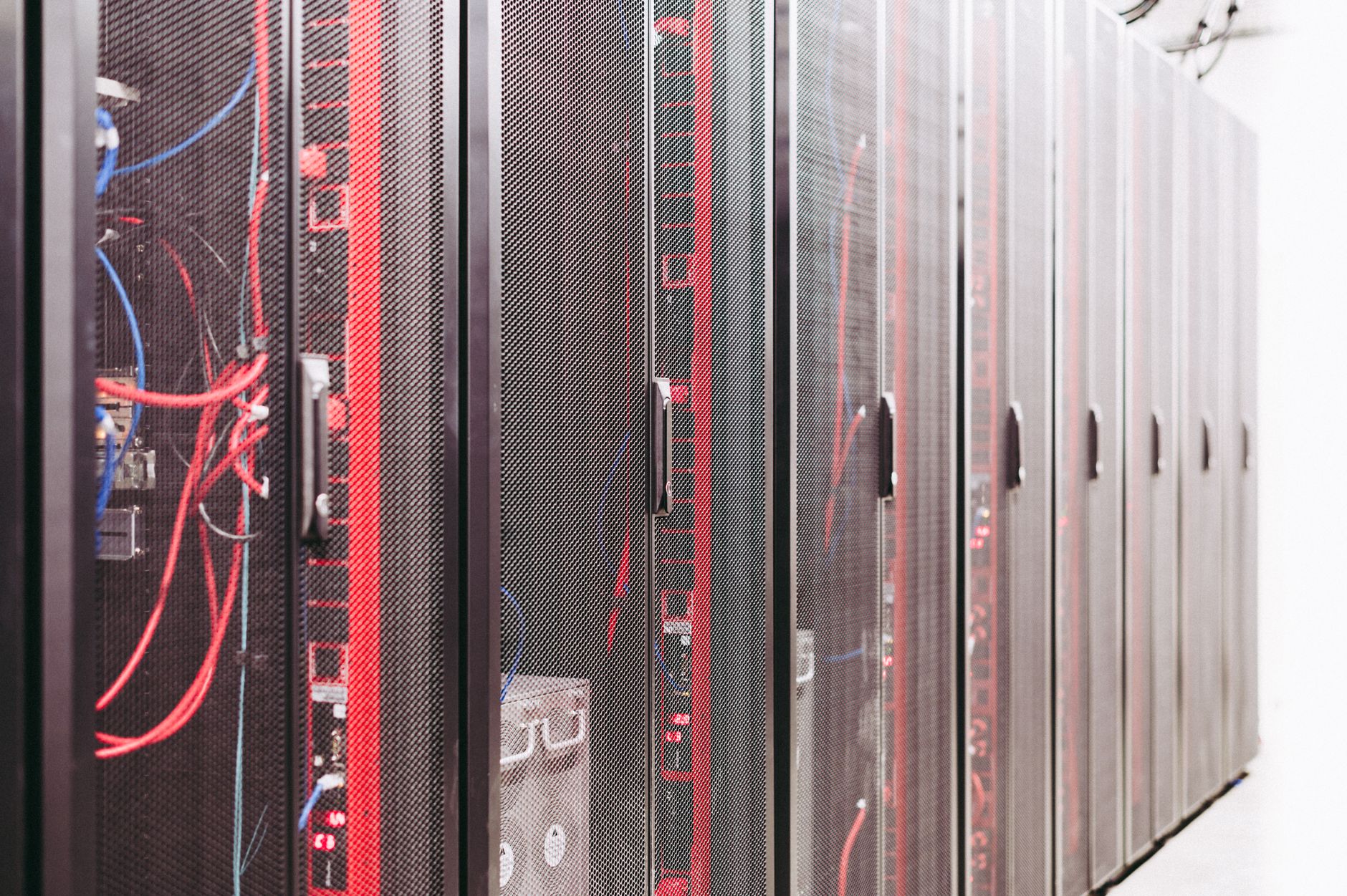 Server racks and industrial control screens representing a plant historian data architecture