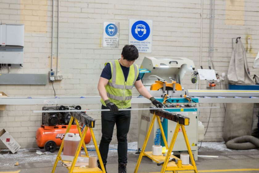 Manufacturing operator entering an electronic signature on a tablet at a production line