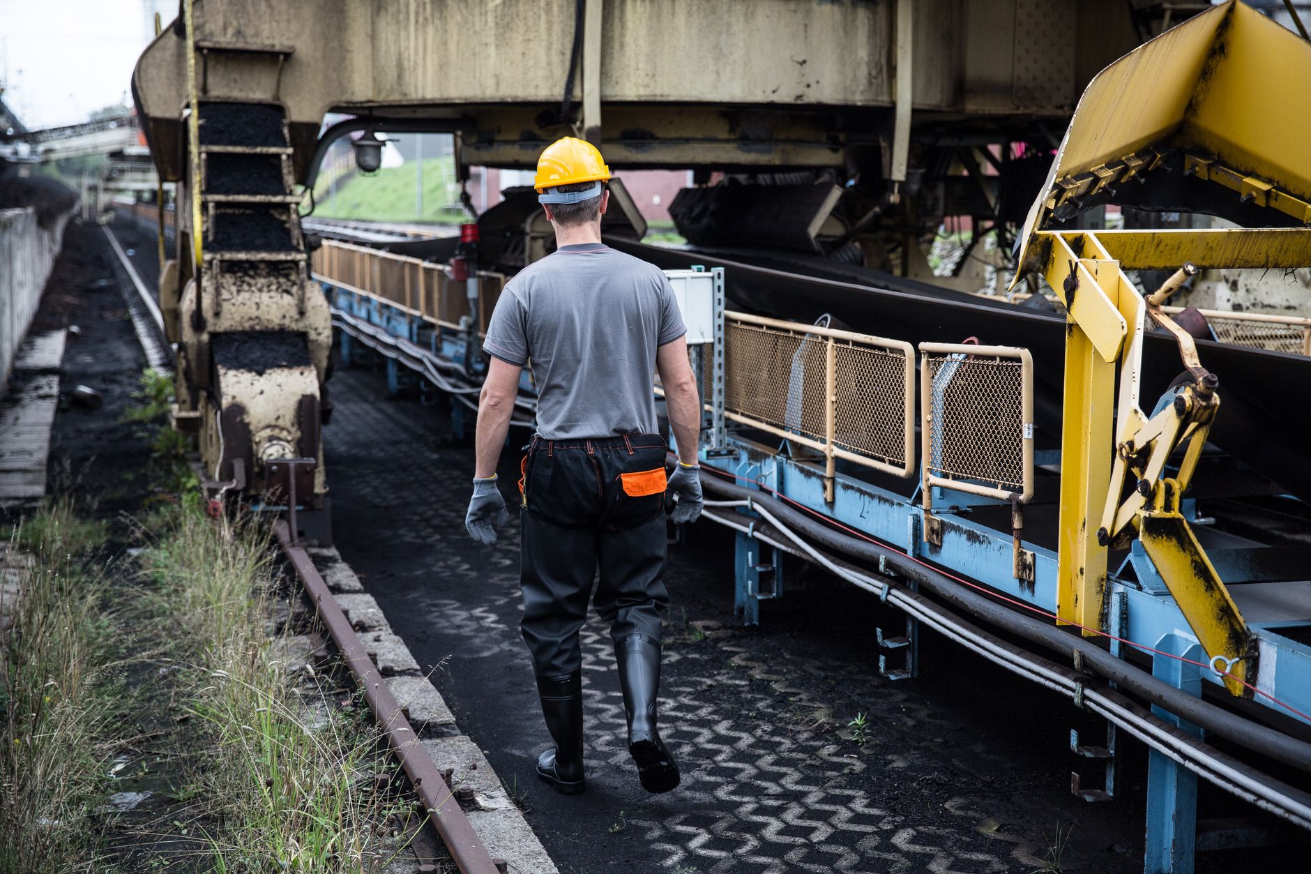 Work-in-process parts queued in a buffer zone between automated production stations