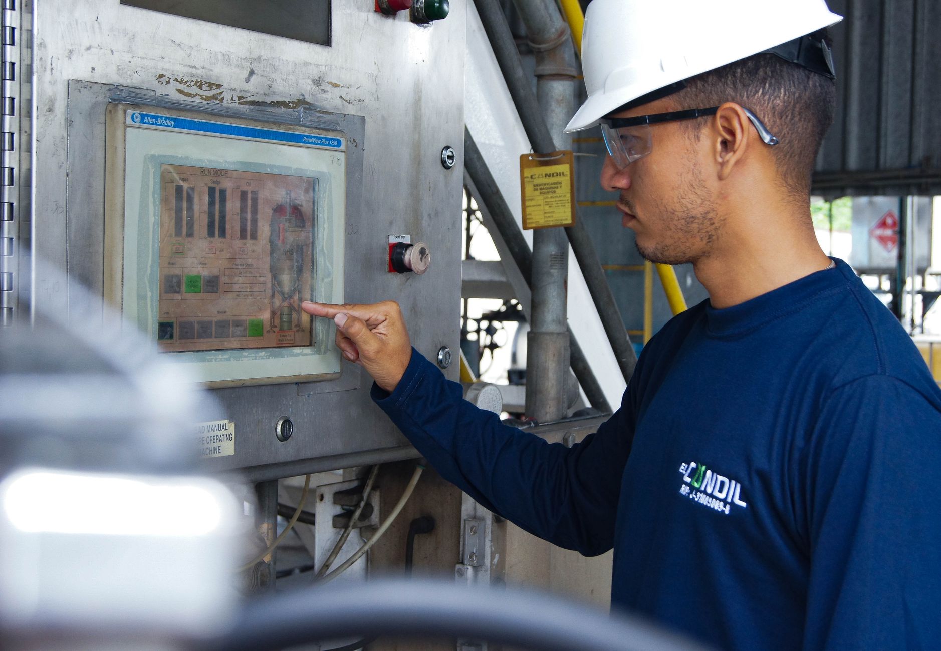 Operator selecting a downtime reason code on a shop floor touchscreen terminal