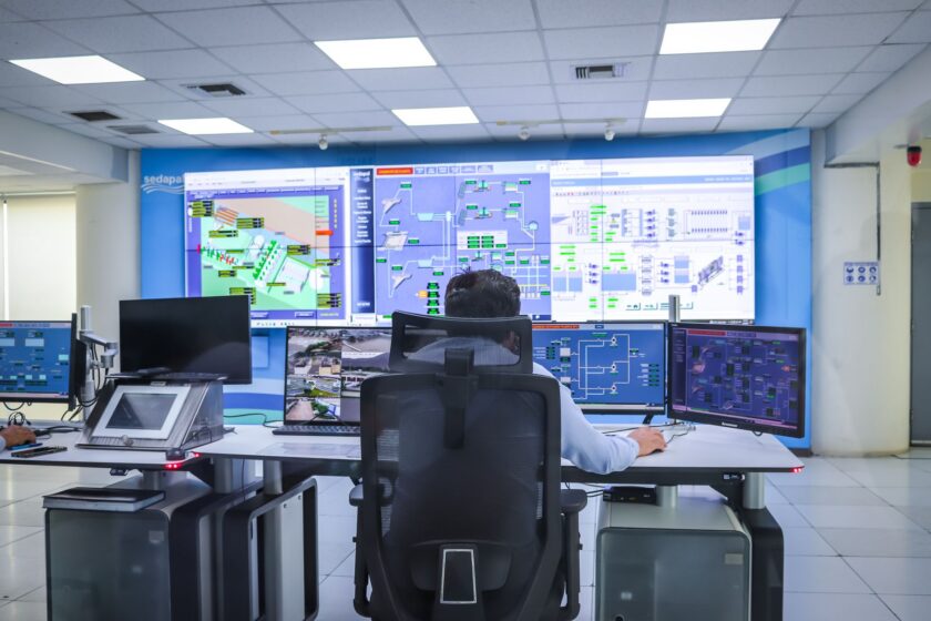 Rows of historian tag data displayed on industrial monitoring screens in a control room