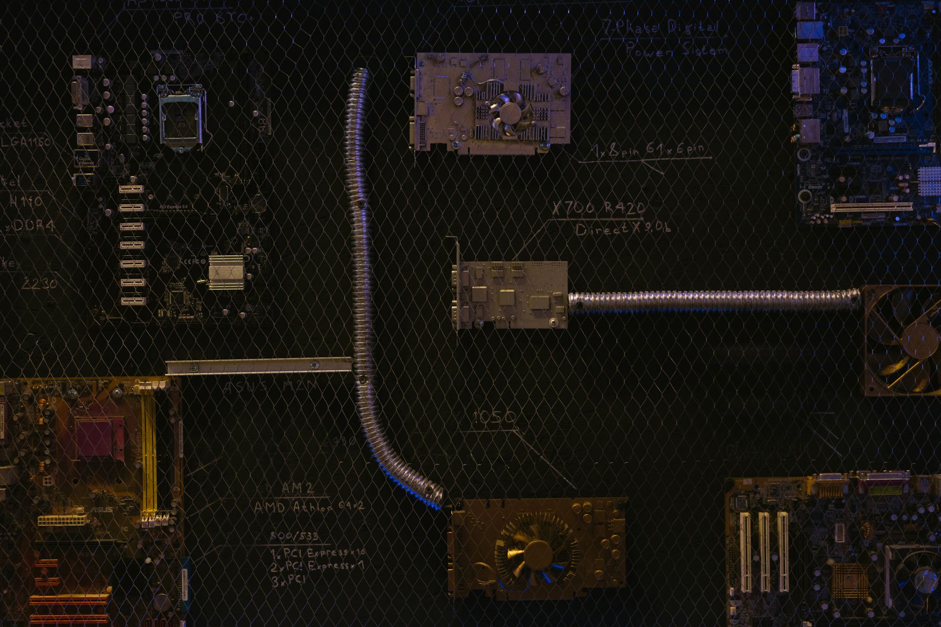 Engineer reviewing an industrial network segmentation diagram on a laptop near plant floor equipment