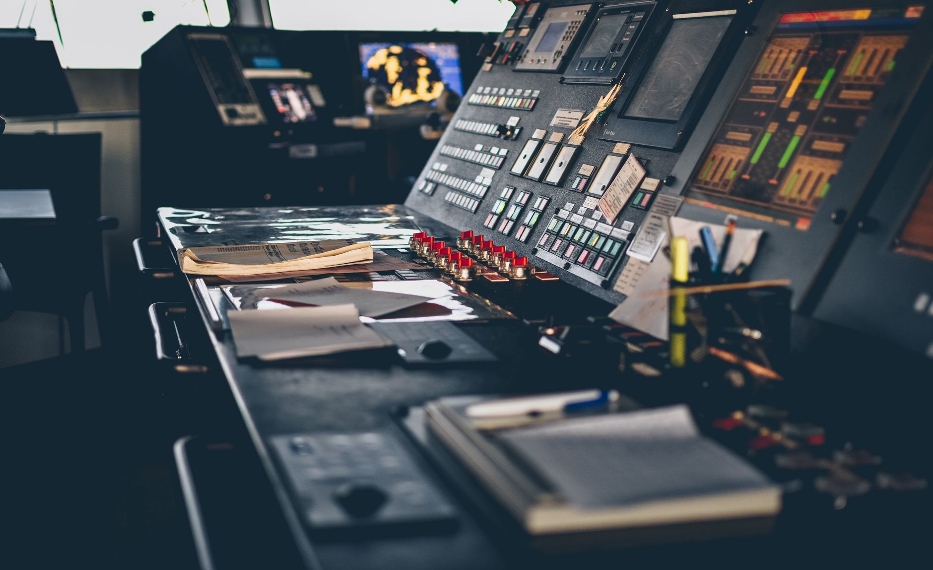 Control room operator viewing an industrial software dashboard on multiple monitors