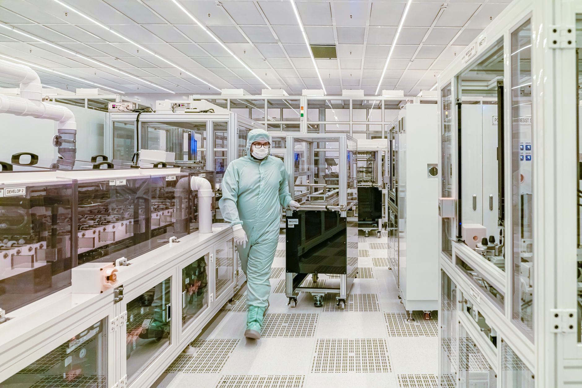 Engineer monitoring semiconductor fabrication equipment through an MES dashboard